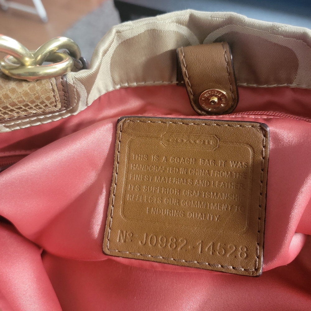 Coach (retired style) Beige and gold , orange satin finish in the interior.